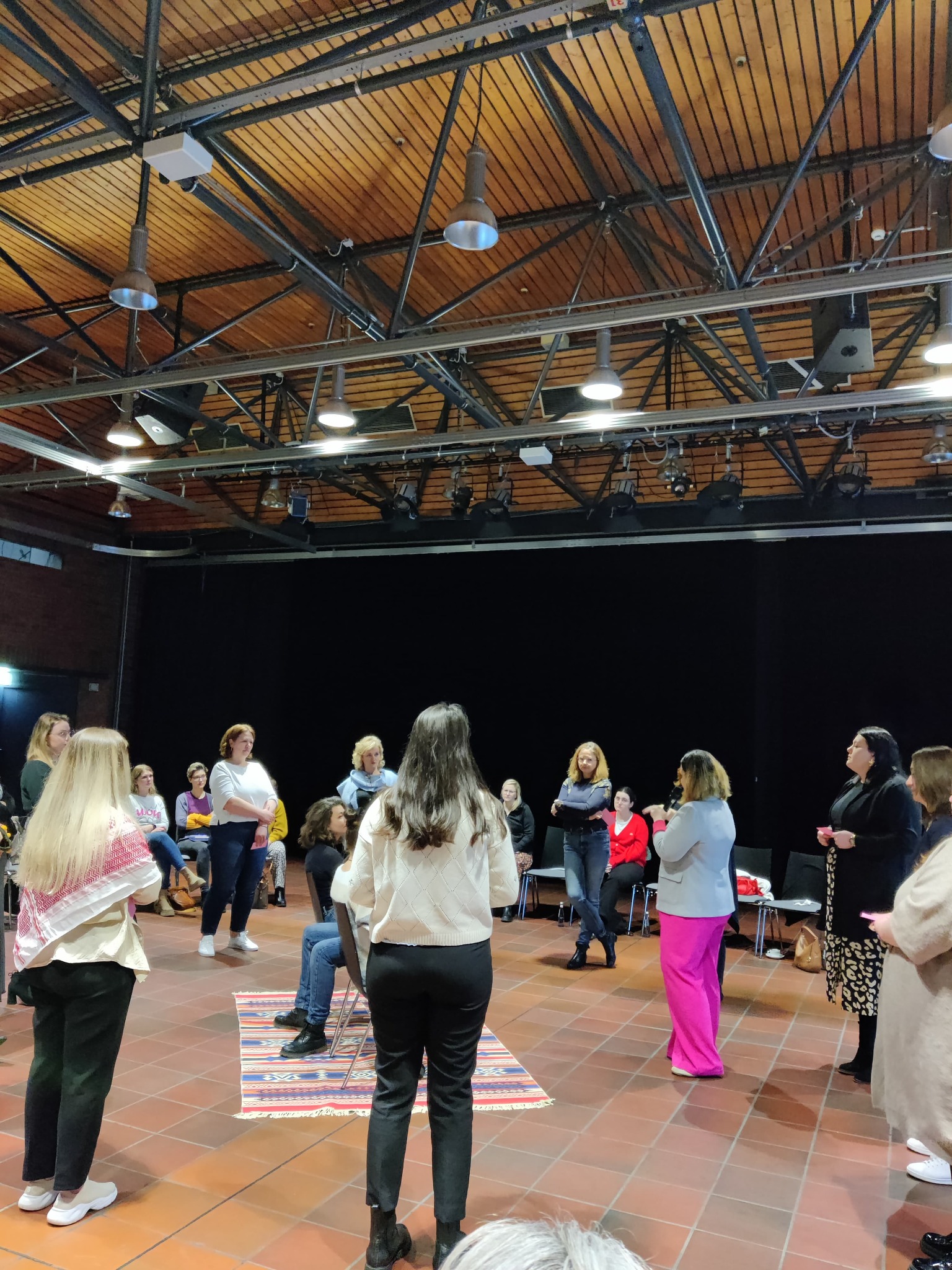 Selma guiding a conversation with women at a gathering